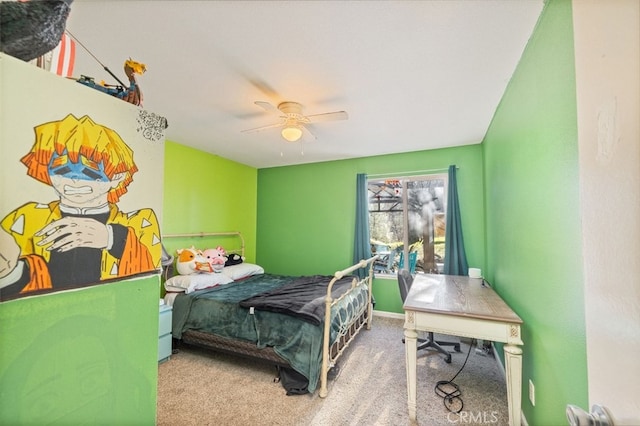 bedroom featuring ceiling fan and carpet