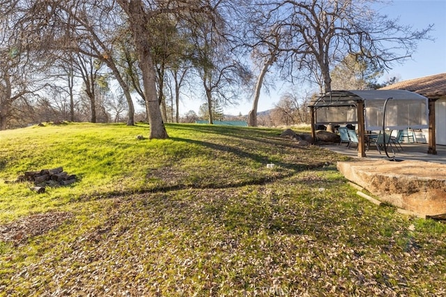 view of yard featuring a patio area and a gazebo