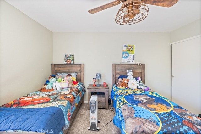 bedroom featuring ceiling fan and light colored carpet