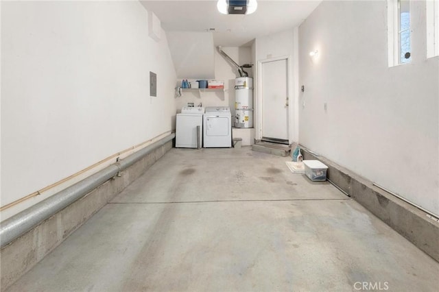 garage with water heater, a garage door opener, and washer and dryer