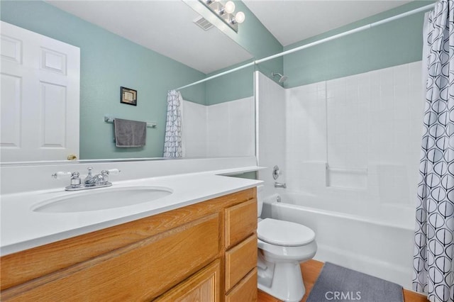 full bathroom featuring toilet, vanity, and shower / bath combo