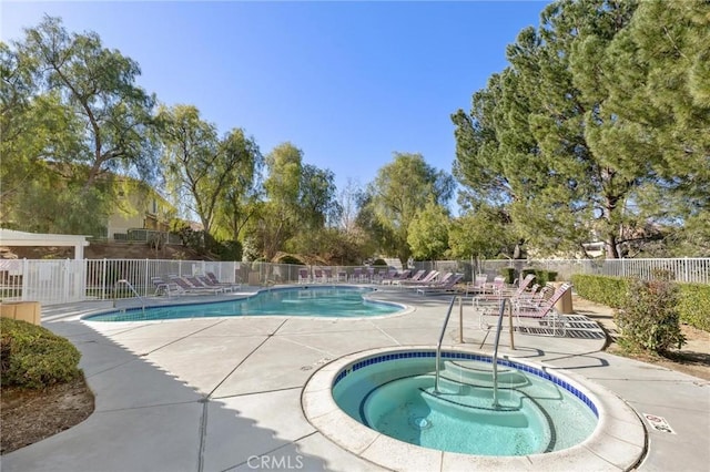 view of pool featuring a community hot tub and a patio