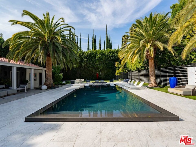 view of swimming pool featuring a patio