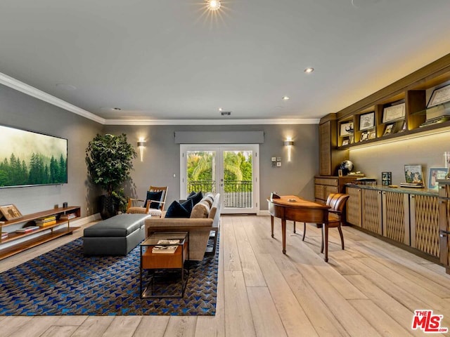 living room featuring light hardwood / wood-style flooring, crown molding, and french doors