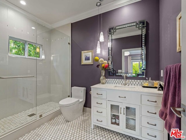 bathroom featuring vanity, backsplash, toilet, walk in shower, and crown molding