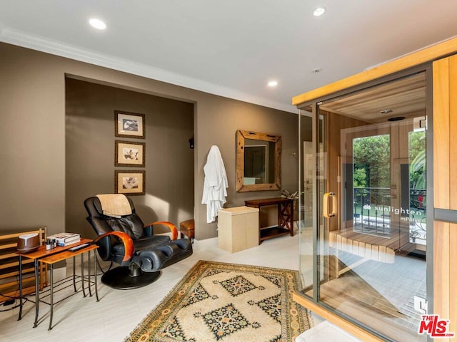 sitting room featuring ornamental molding