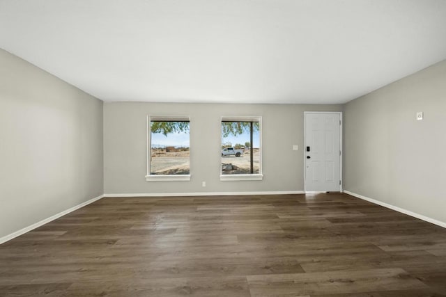 unfurnished room featuring dark hardwood / wood-style floors