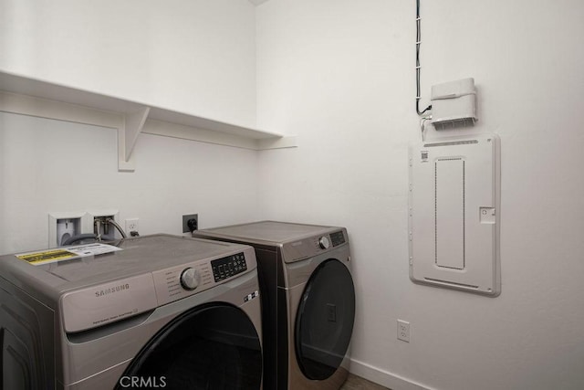 clothes washing area featuring washer and clothes dryer