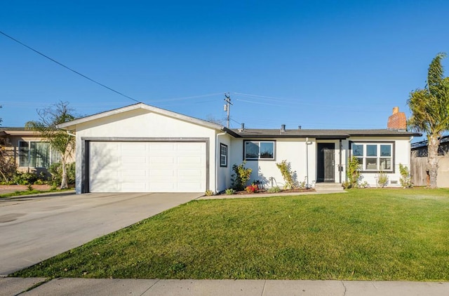 ranch-style house featuring a front yard and a garage