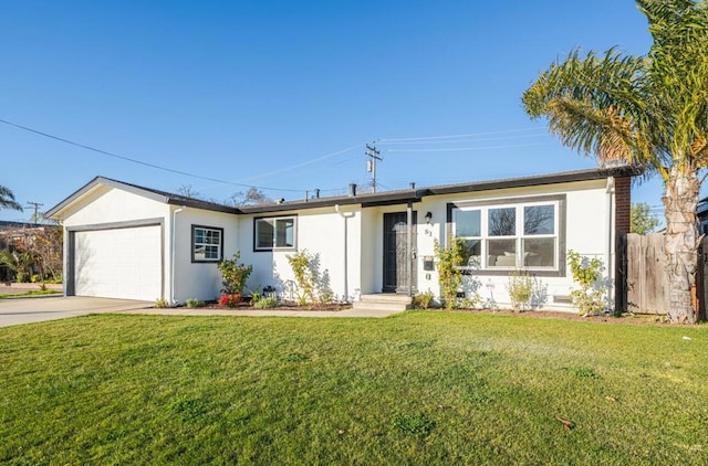 ranch-style home with a front lawn and a garage