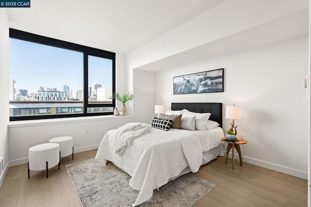 bedroom with light wood-type flooring