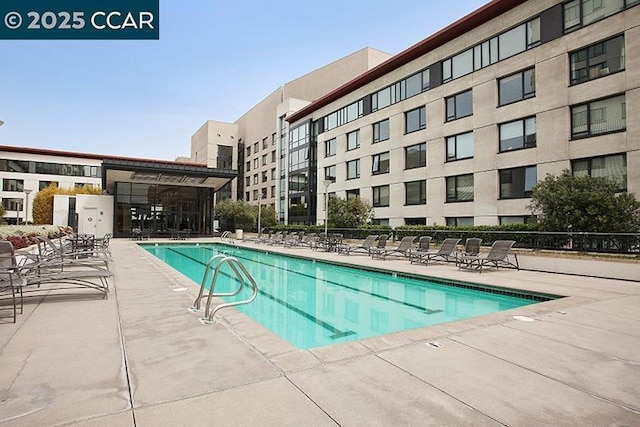 view of pool featuring a patio