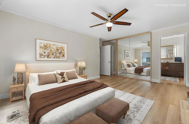 bedroom with ensuite bathroom, crown molding, light wood-type flooring, a closet, and ceiling fan