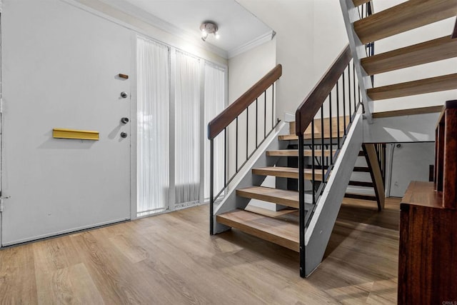 6309 Caminito Salado, San Diego, CA 92111 - entryway featuring crown molding, wood finished floors, and stairway