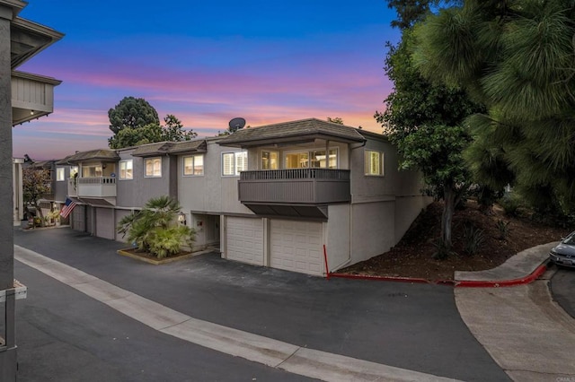 6309 Caminito Salado, San Diego, CA 92111 - view of front facade with a balcony, a garage, and driveway