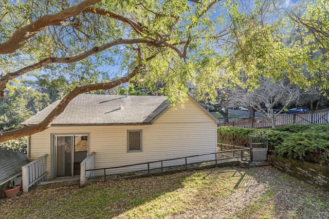 view of side of property with a yard