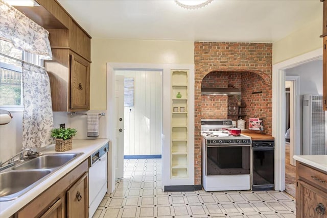 kitchen featuring sink and white appliances