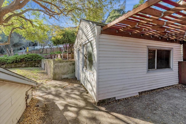 view of home's exterior featuring a pergola