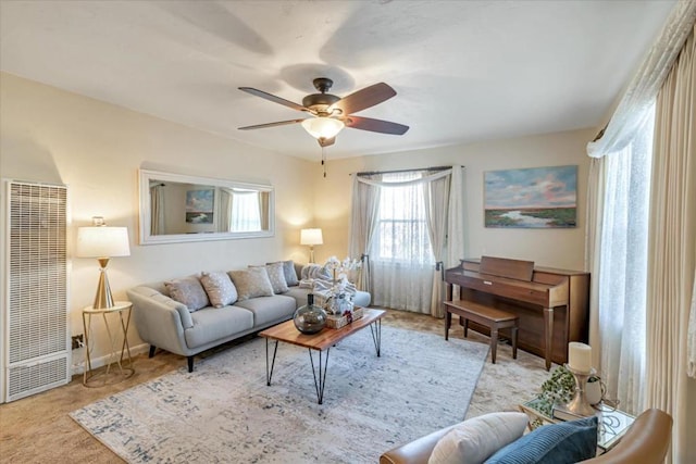 living room with light carpet and ceiling fan