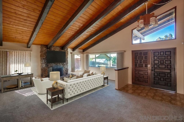 carpeted living room with high vaulted ceiling, a stone fireplace, beam ceiling, and wood ceiling