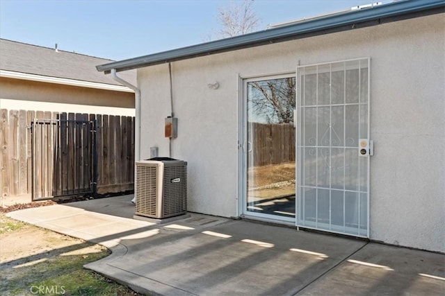 exterior space featuring central AC unit and a patio