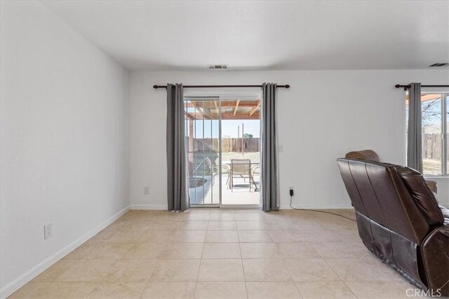 unfurnished office featuring light tile patterned floors