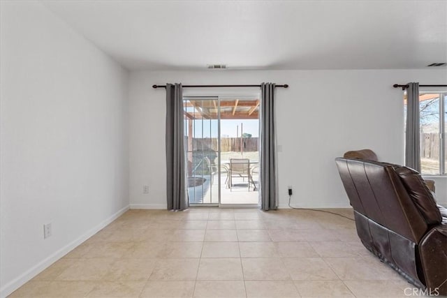 unfurnished office with light tile patterned floors