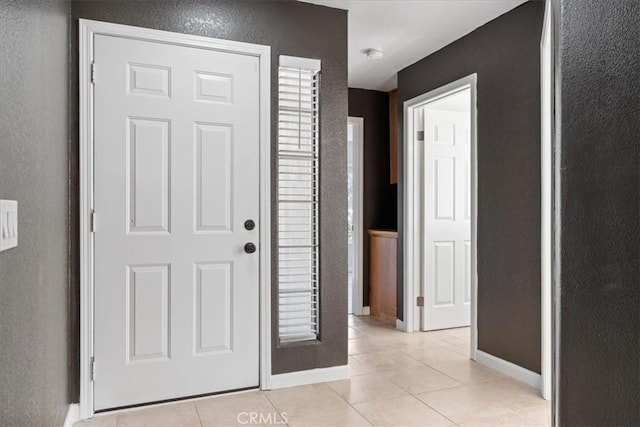 entrance foyer featuring light tile patterned floors