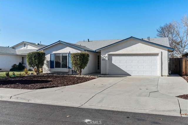 ranch-style house featuring a garage