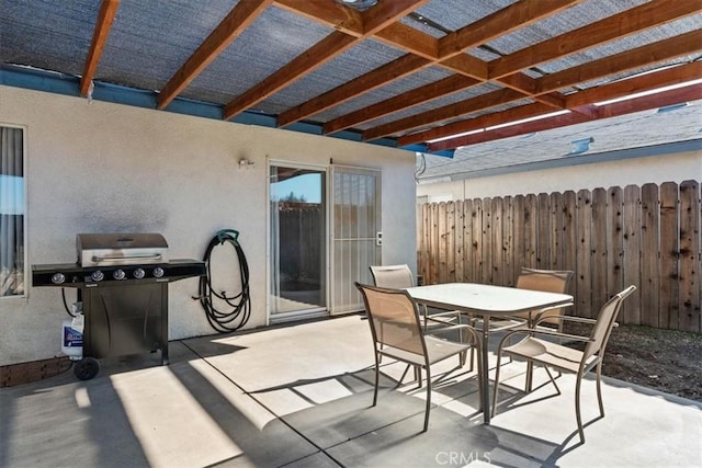 view of patio featuring area for grilling and a pergola