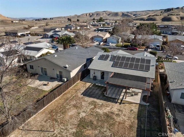 birds eye view of property with a mountain view