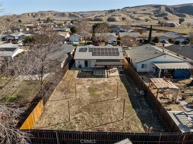 birds eye view of property with a mountain view