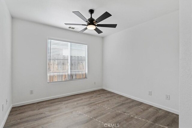 unfurnished room featuring ceiling fan and light hardwood / wood-style floors