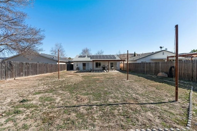 back of property with solar panels