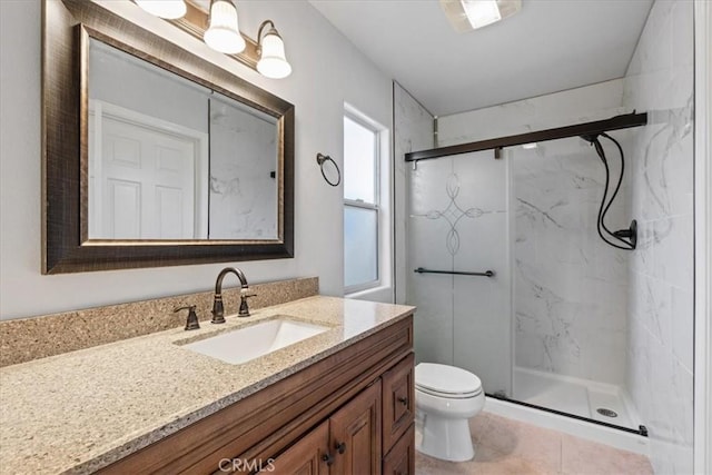 bathroom featuring an enclosed shower, vanity, tile patterned flooring, and toilet