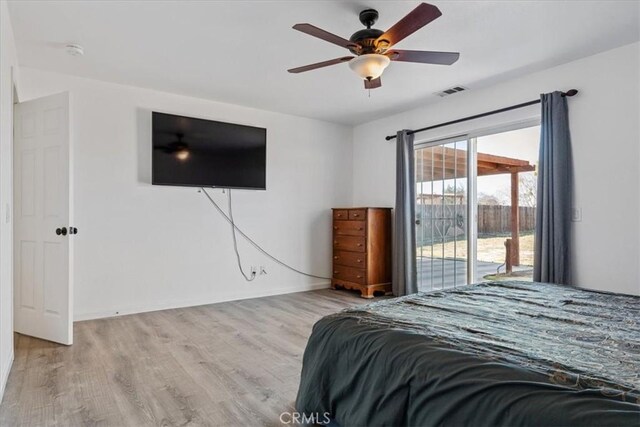 bedroom with ceiling fan, access to exterior, and light wood-type flooring