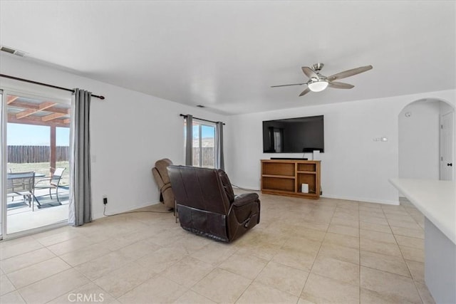 living room with light tile patterned floors and ceiling fan