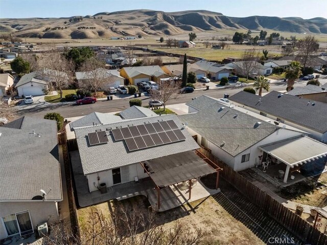 birds eye view of property featuring a mountain view