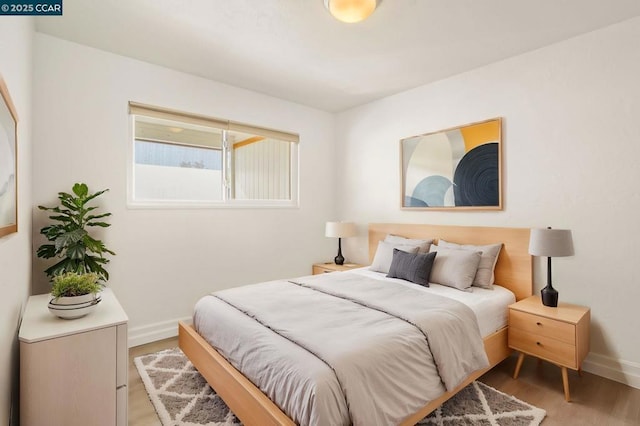 bedroom featuring light wood-type flooring