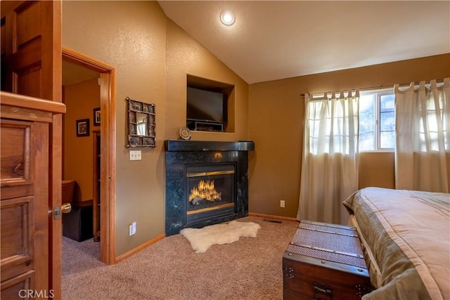 carpeted bedroom with vaulted ceiling