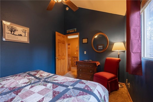 bedroom featuring ceiling fan, carpet floors, and lofted ceiling