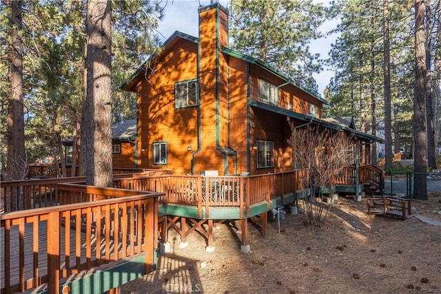 rear view of property with a deck