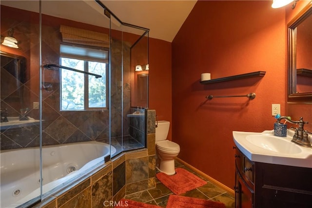 full bathroom featuring lofted ceiling, tiled shower / bath, tile patterned floors, vanity, and toilet