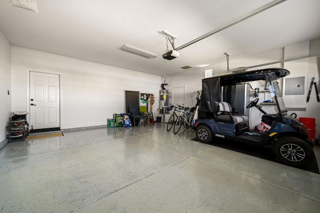 garage with electric panel and a garage door opener