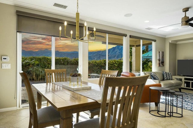 tiled dining area featuring ceiling fan with notable chandelier and crown molding