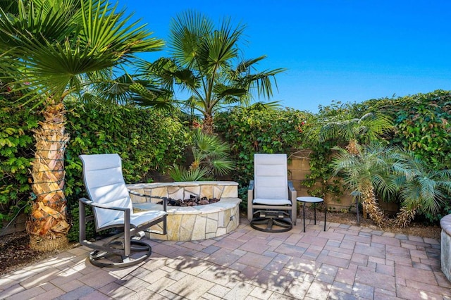 view of patio with a fire pit