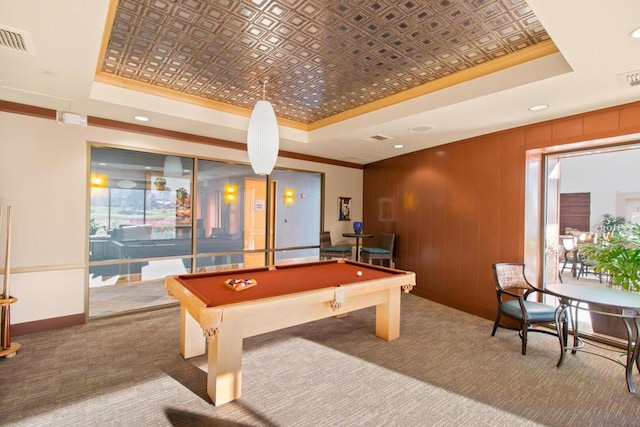 recreation room with carpet flooring, ornamental molding, a tray ceiling, and billiards