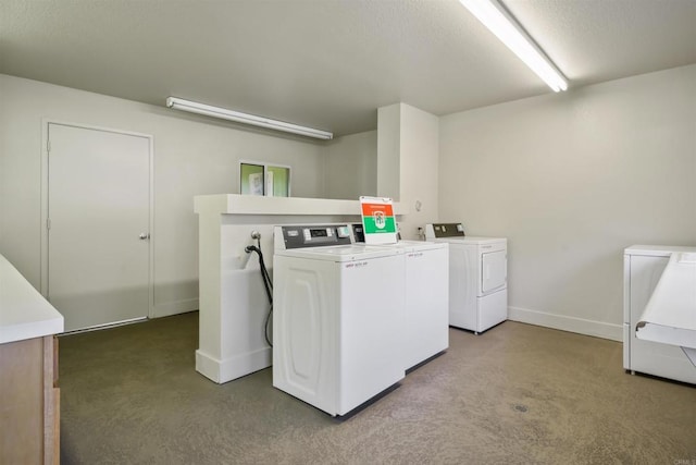 laundry room featuring separate washer and dryer