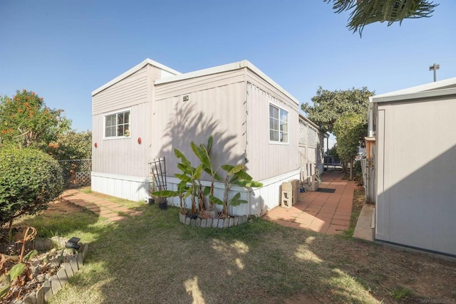 view of property exterior featuring a yard