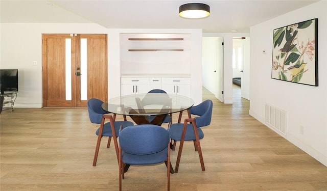 dining room featuring light hardwood / wood-style flooring